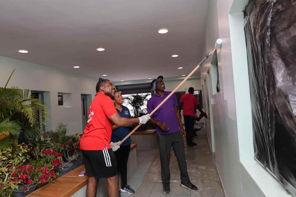 PM Terrance Drew volunteers for enhancement work of JNF’s entrance